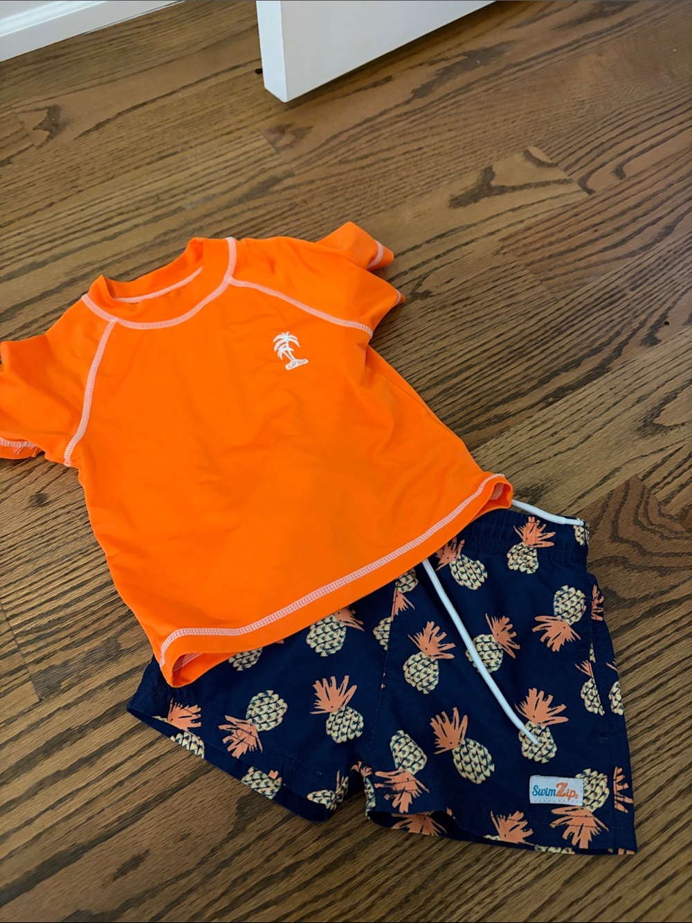 Kids Orange Short-Sleeve Rashguard with Navy Pineapple Swim Shorts